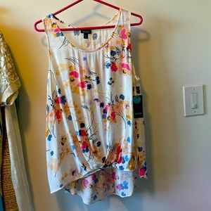 Cream tank top with flowers. Very light & airy.